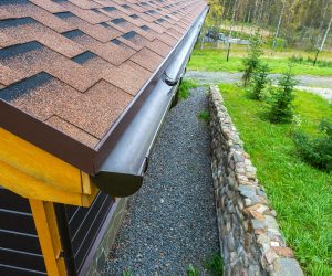 Holder gutter drainage system on the roof. Drain on the roof of the house. Roof drainage. Water drainage from the roof.